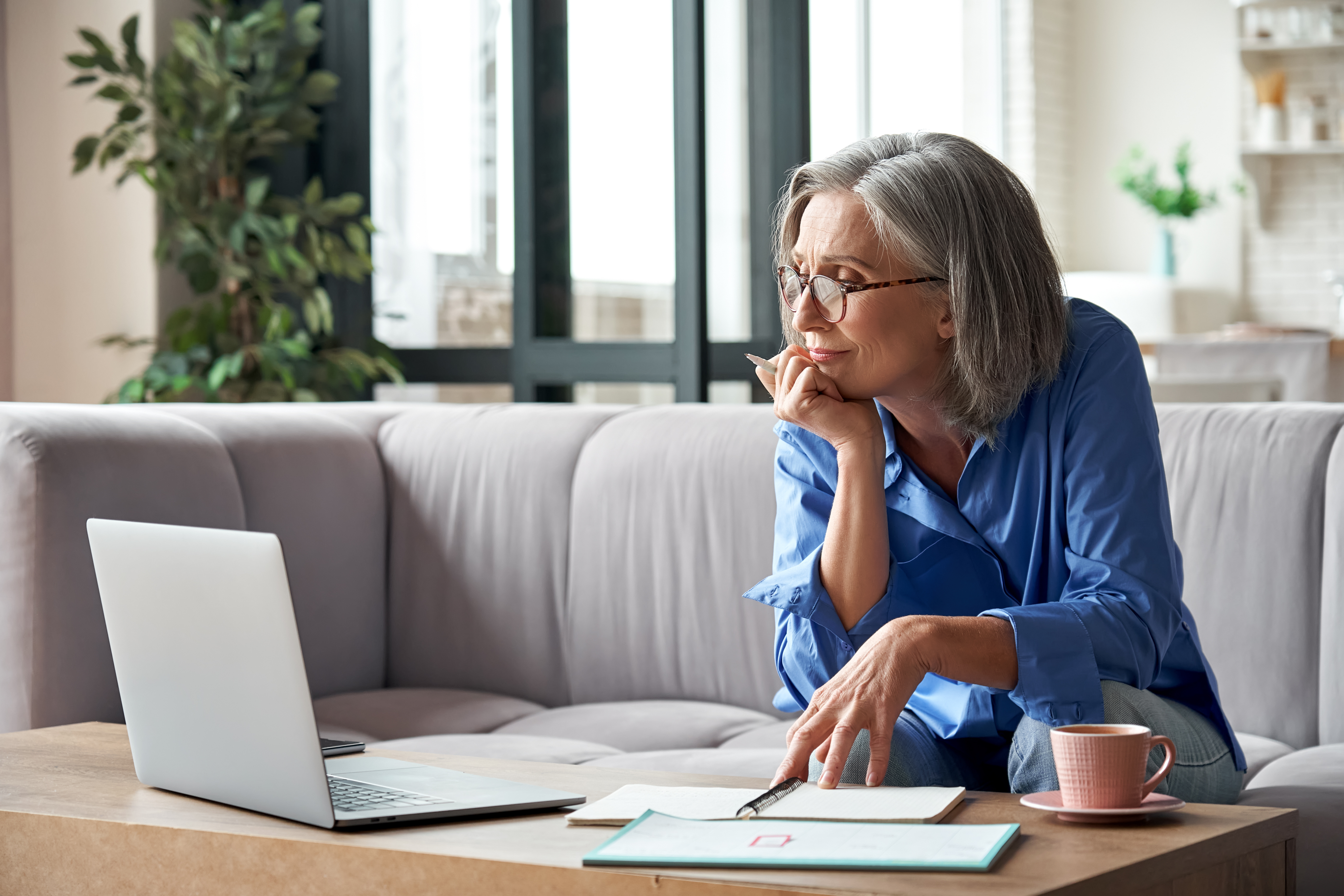 woman listening to webinar